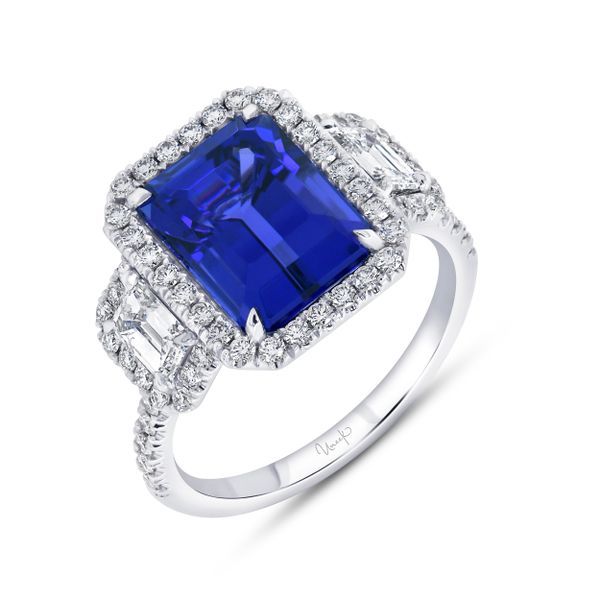 Exklusiv guldring med en stor blå safir och diamanter